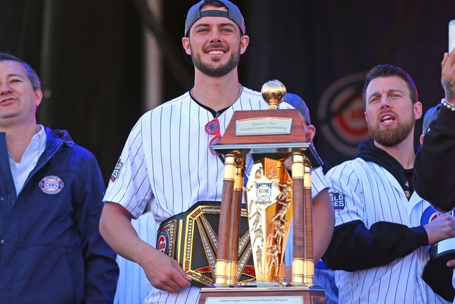 Kris Bryant holding the World Series trophy at the Chicago Cubs