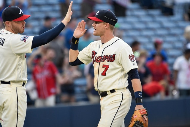 Atlanta Braves' Gordon Beckham throws out a St. Louis Cardinals