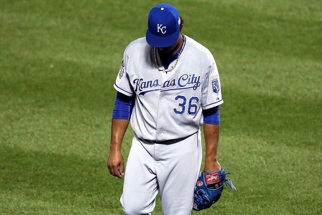 Kansas City Royals pitcher Edinson Volquez (36) talks to catcher