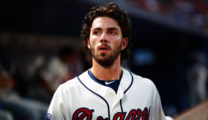 Dansby Swanson knocked out of game after errant throw to pitcher