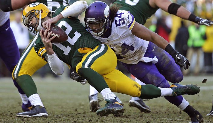 Minnesota Vikings' Danielle Hunter sacks Green Bay Packers' Aaron Rodgers  during the second hal …