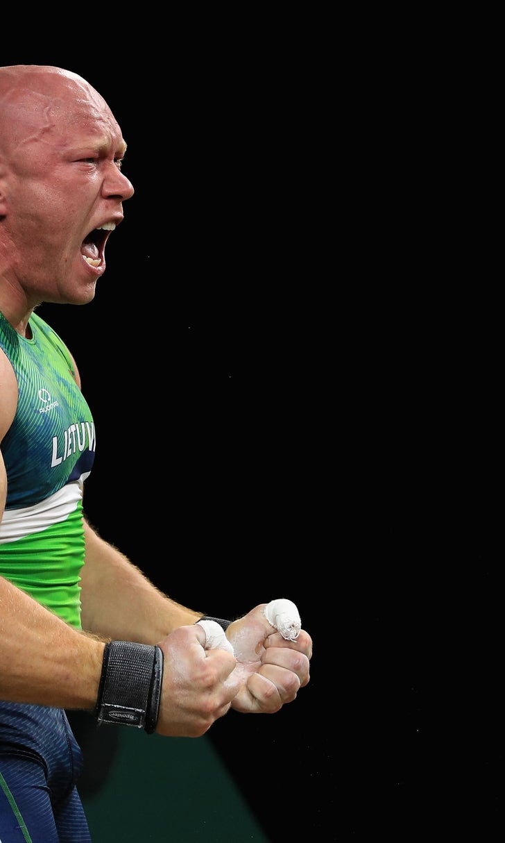 Olympic weightlifter celebrates medal with an incredible backflip FOX