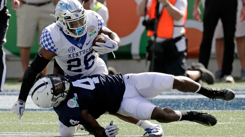 Snell runs wild, No. 16 Kentucky holds off No. 13 Penn State