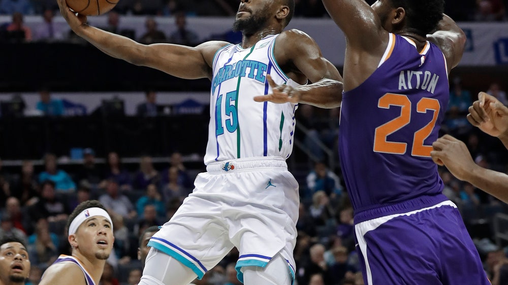 Walker scores 21 points to help Hornets rout Suns 135-115