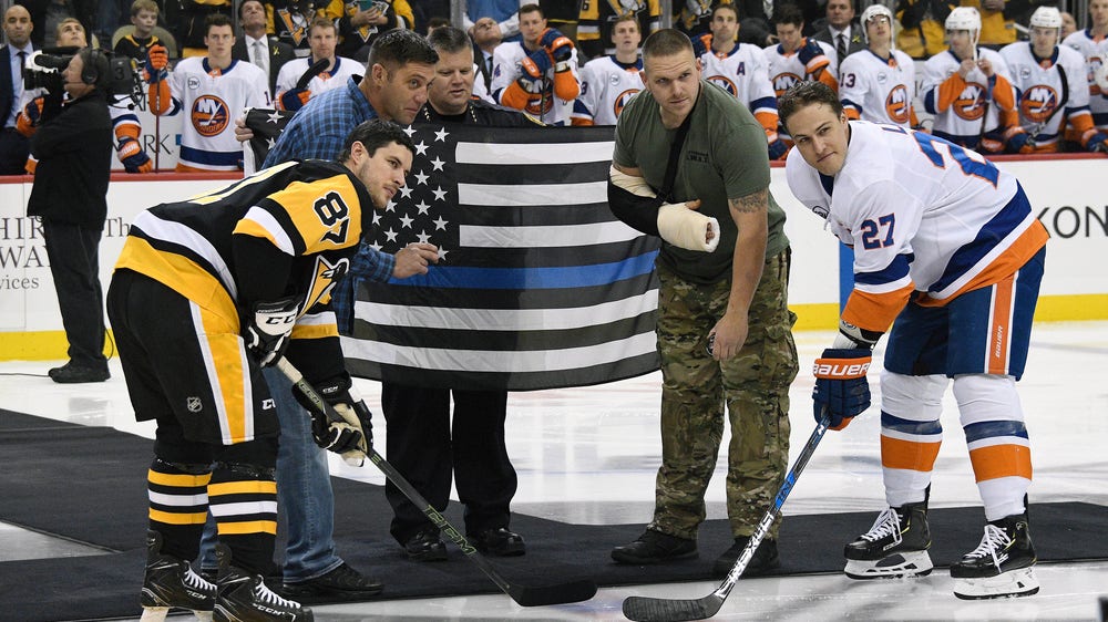 Penguins honor shooting victims with ceremony, special logo