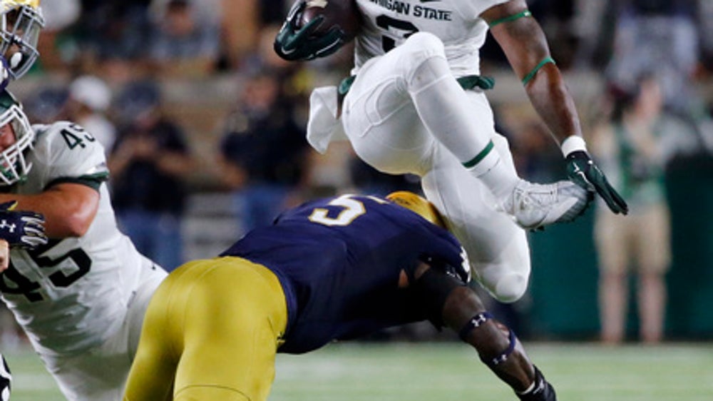 Dantonio says Scott has resolved license issues, will play