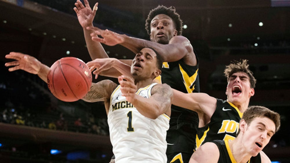 No. 15 Michigan overcomes Iowa in OT 77-71 in Big Ten