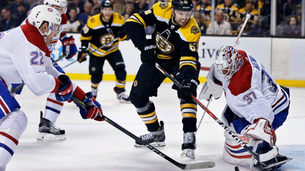 Marchand scores in OT, Bruins rally past Canadiens 2-1