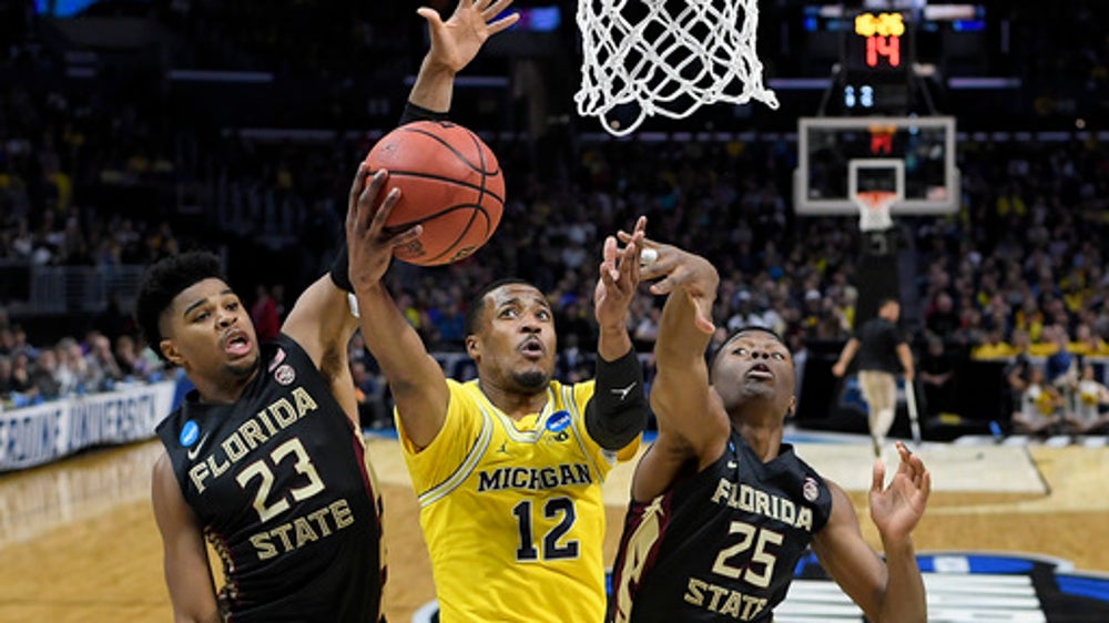 Michigan heads to Final Four in role of upset stopper