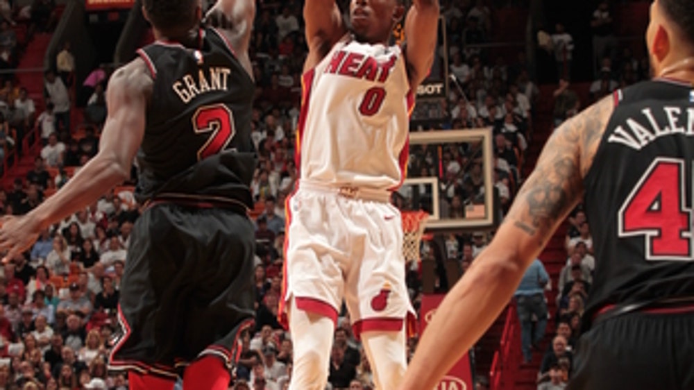 Heat close in on clinching, top Bulls 103-92