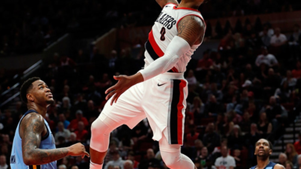 Blazers clinch playoff spot, then beat Grizzlies 113-98
