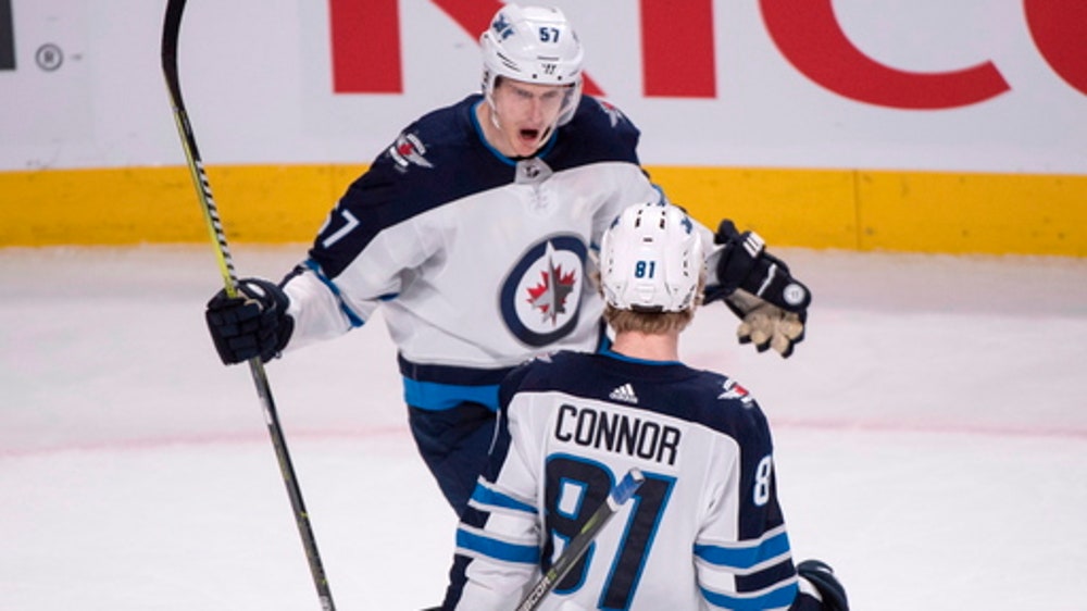 Jets reach 50 wins with 5-4 OT triumph over Canadiens