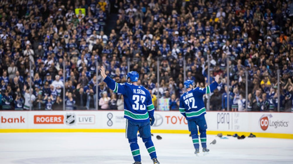 Sedin twins combine on OT winner in their final home game