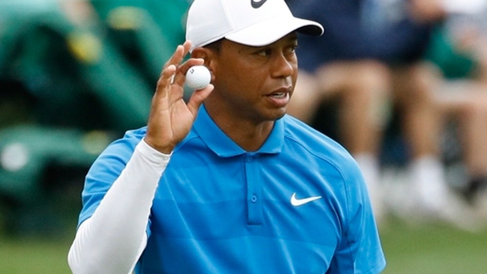 The Latest: Woods finds form, finishes Masters with a flurry