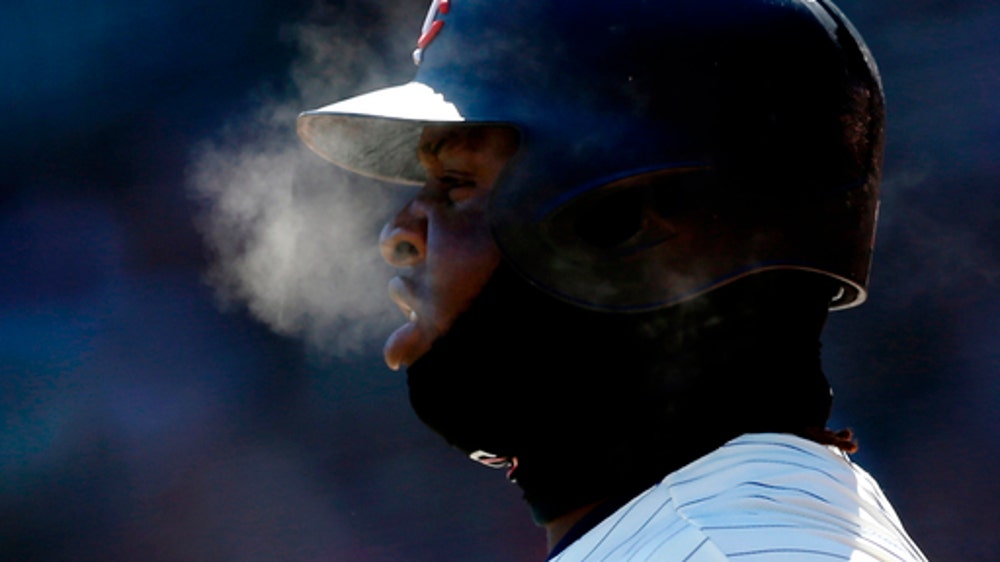 Just Chillin': Players, fans and dogs bundle up at MLB parks