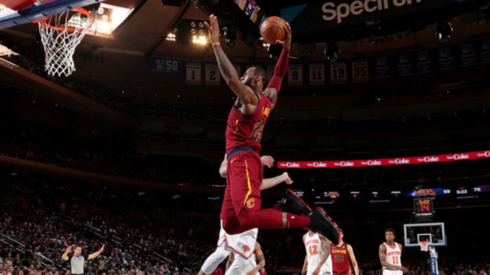 James, Love lead Cavs past Knicks to 50th win, Central title