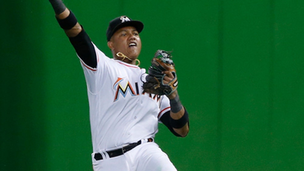 Albies hits a slam, Braves roll past Marlins 9-2