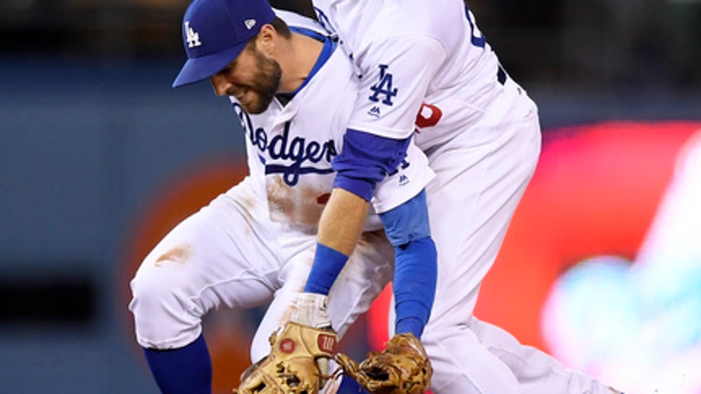 LEADING OFF: Dodgers seek spark in Miami, Pollock hurt