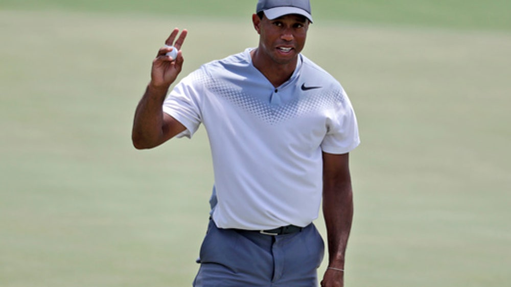 Heat of Tigermania leaves Woods’ playing partner shivering