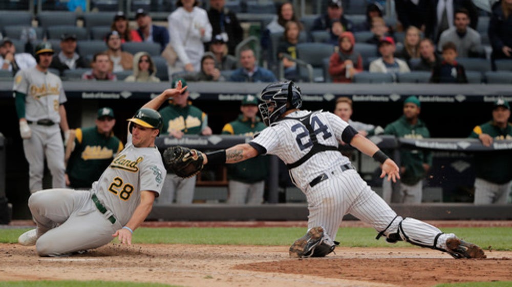With help of reversal, Yanks top A’s 7-6, stop tiny skid