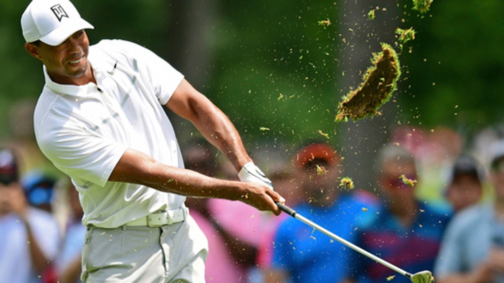 Woods rallies to salvage par in return to Memorial