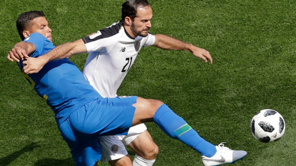 AP PHOTOS: Brazil leaves it late on Day 9 of World Cup