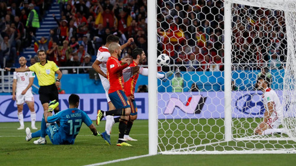 Spain draws 2-2 with Morocco, reaches World Cup round of 16