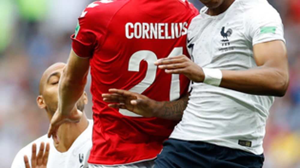 AP PHOTOS: Argentina squeaks through on Day 13 at World Cup