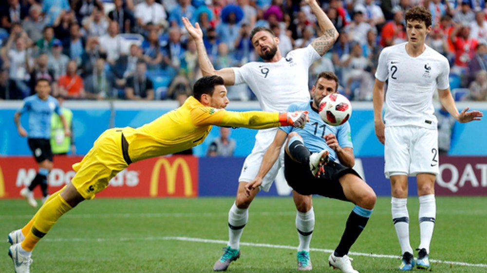 AP PHOTOS: Defenses crack, last of World Cup’s giants falls