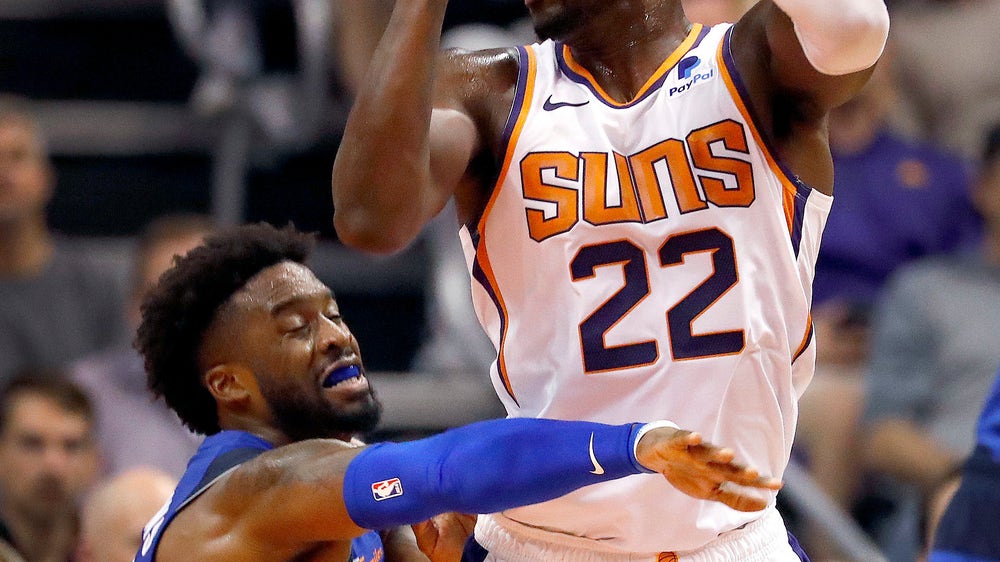 Booker’s late onslaught lifts Suns past Mavs 121-100