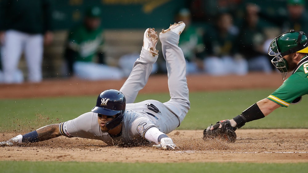Jordan Lyles a winner in return to Brewers, 4-2 over A's