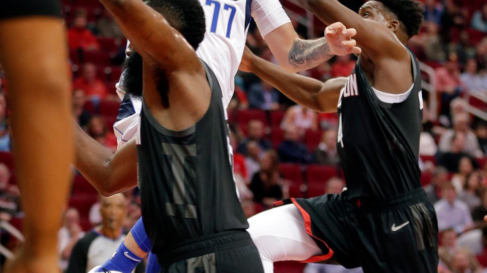 Doncic helps Mavs rout Rockets 128-108