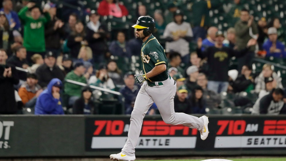 A's clinch wild card spot, tied with Rays after loss to M's