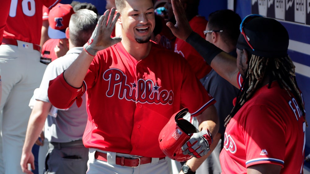 Fans inform Phillies of Harper news during spring game
