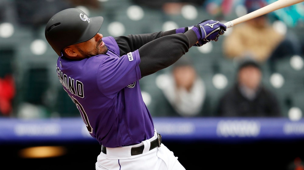 Rockies rally to beat Giants 12-11 at wintry Coors Field