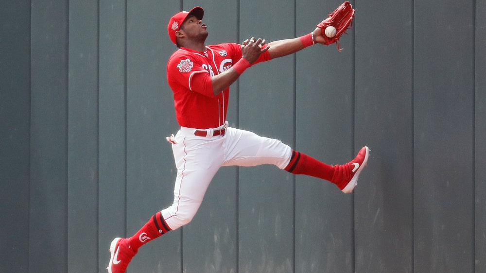 Puig returns with RBI double, Reds sweep Marlins 5-0