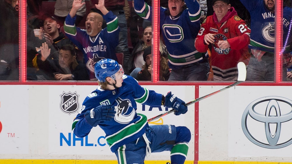 Canucks erase deficit, rally past Blackhawks 7-5