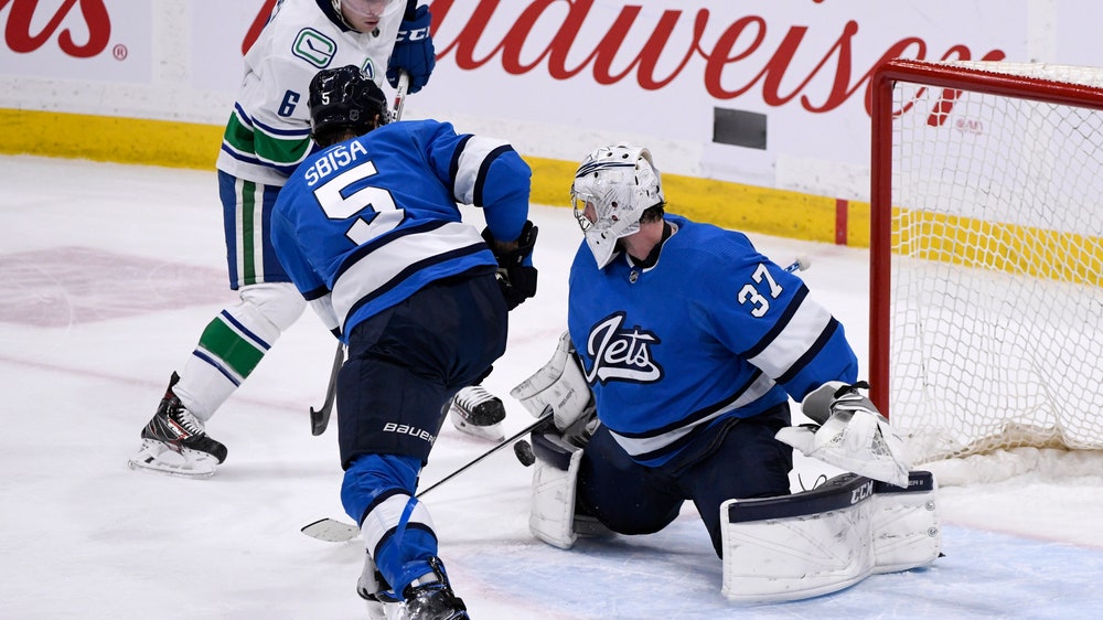 Hellebuyck's 41 saves leads Jets past Canucks 4-0