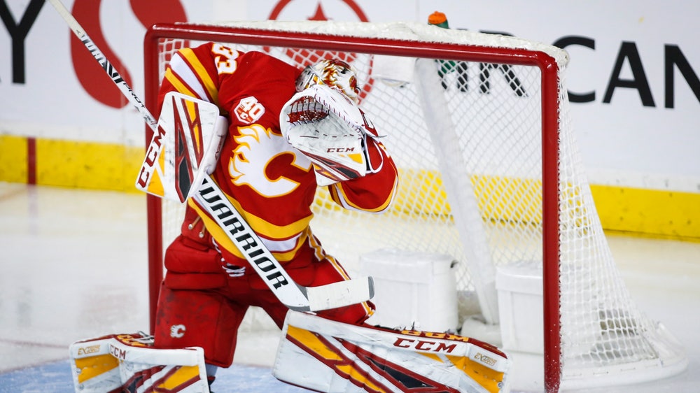 Rittich earns a shutout, Flames blank Canucks 3-0