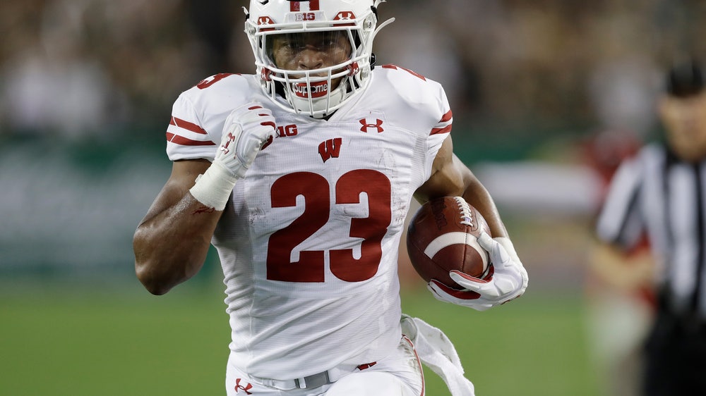 Taylor scores 4 TDs, No. 19 Wisconsin routs USF 49-0