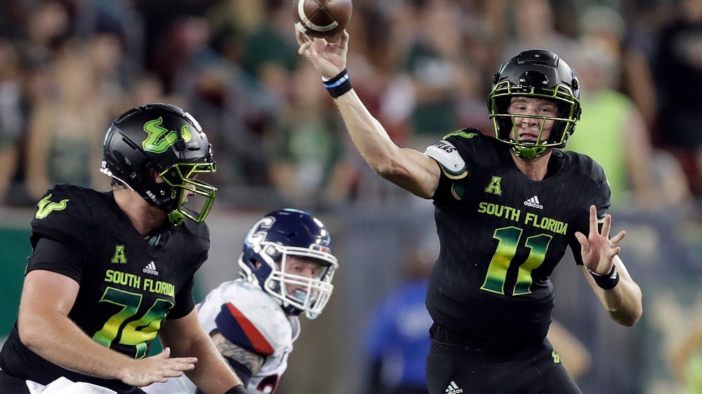 Ford runs for 3 TDs, No. 21 South Florida beats UConn 38-30
