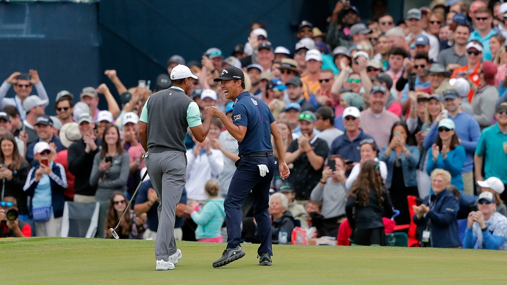 Woods lands birdie, laughs at famed 17 after quadruple-bogey
