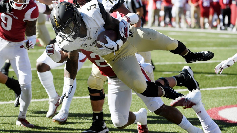 Vaughn’s 3 touchdowns spark Vandy past Arkansas, 45-31