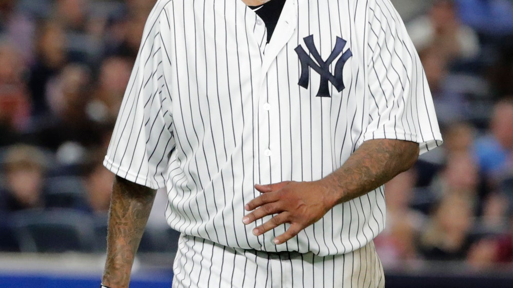 Sabathia helps Yanks beat Orioles 10-8, close on wild card