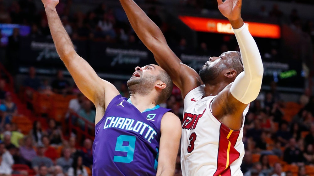 Dragic, Wade lead Heat past Hornets, 93-75