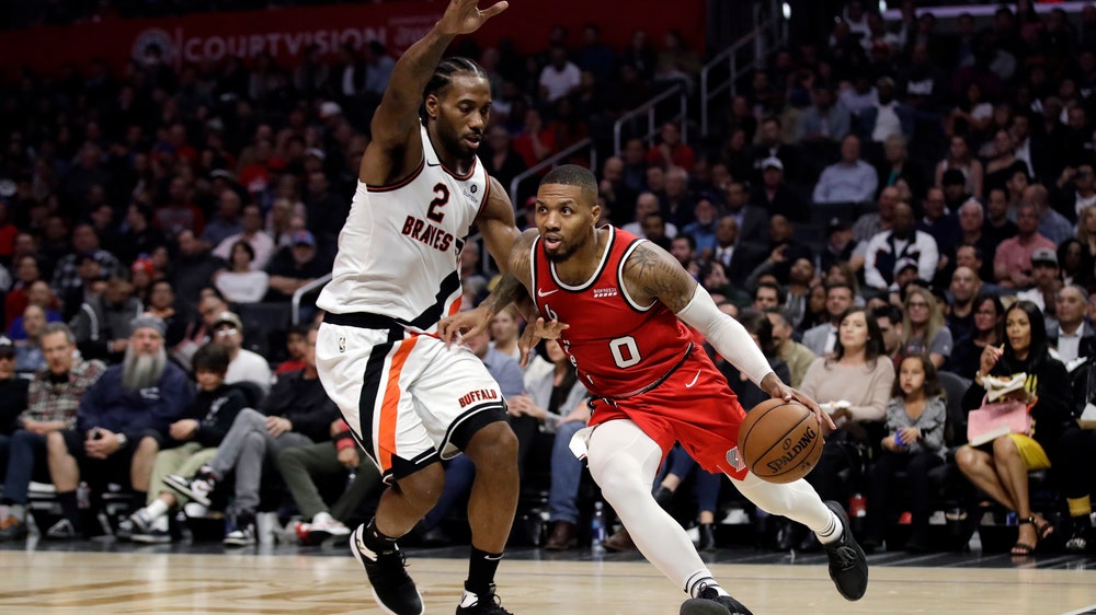 Clippers beat Trail Blazers 107-101 for Rivers' 900th win