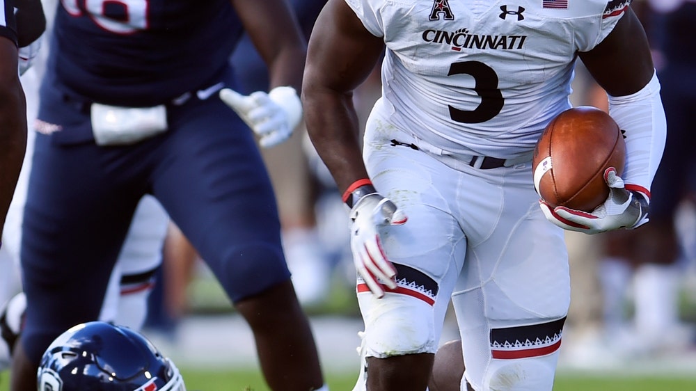 Cincinnati remains undefeated with 49-7 rout over UConn