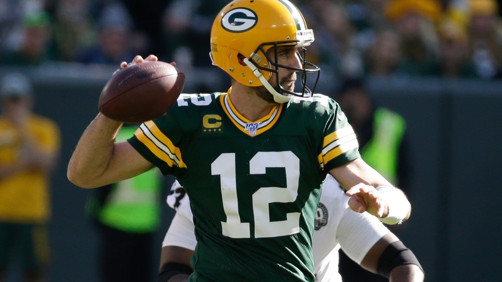 Rodgers has 5 TD passes, 1 rushing score as Packers roll