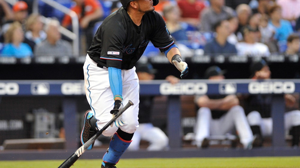 Rojas, Marlins break loose, top Rockies 7-3 for 1st win