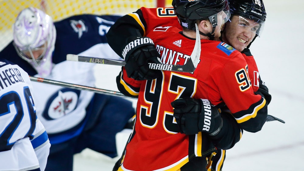 Flames score 5 goals in 1st period again to down Jets 6-3